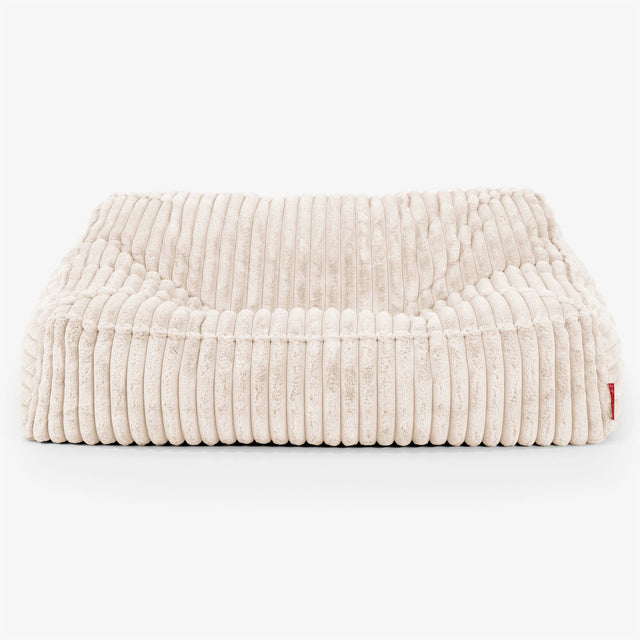 Sofa pufa Sloucher - Sztruks ultra plusz Śmietanka 02